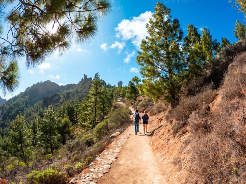 A couple of hikers on the trail up to Roque Nublo in Gran Canaria, Canary Islands