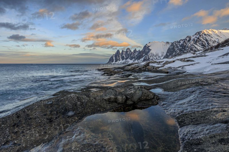 Rocky coast in front of Bergen, sea and pond, morning mood with clouds, winter, Tungeneset, Senja, Troms, Norway, Europe