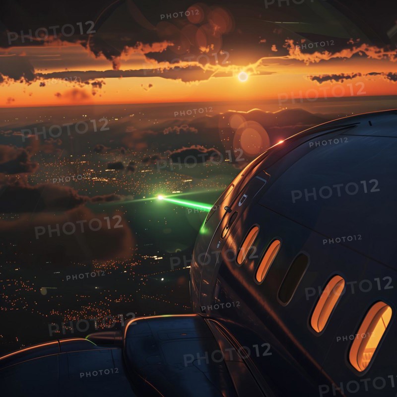 View from an aeroplane window of green laser beams over a city at night, laser attack on an airliner, AI generated