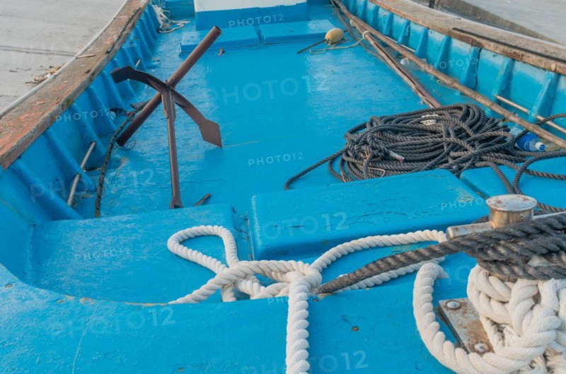 Rope and anchor in boat dry docked on concrete quay in South Korea