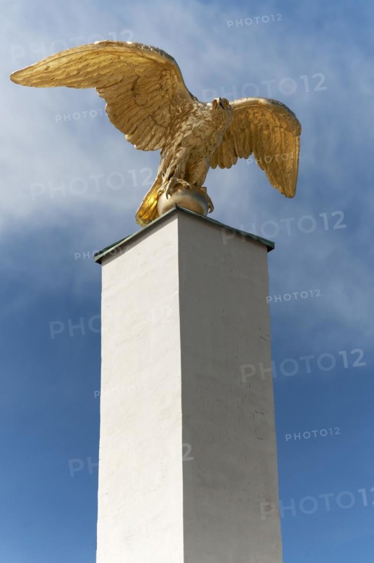 Gilded eagle on an obelisk at the main entrance to Schoenbrunn Palace, Vienna, Austria, Europe
