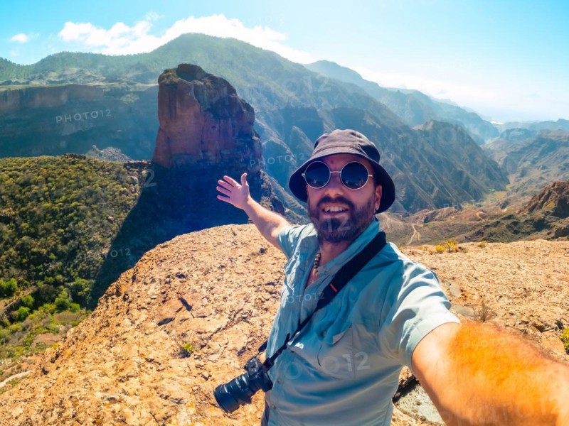 Selfie of a man at the Roque Palmes viewpoint near Roque Nublo in Gran Canaria, Canary Islands