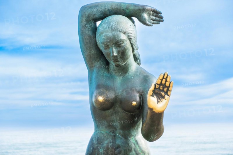 Bust of a siren or mermaid with worn hands and breasts in Sitges, Spain, Europe