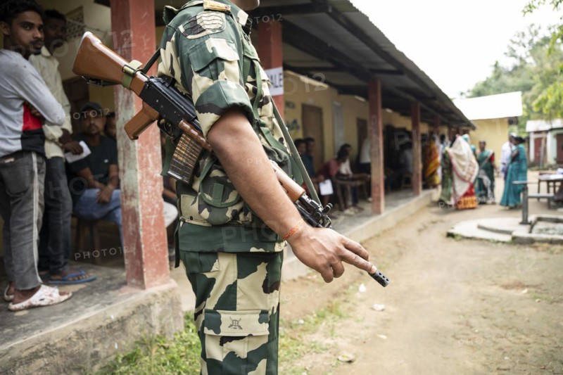 BOKAKHAT, INDIA, APRIL 19: A security personnel stands guard at a polling station during the first phase of the India's general elections on April 19, 2024 in Bokakhat, Assam, India. Nearly a billion Indians vote to elect a new government in six-week-long parliamentary polls starting today
