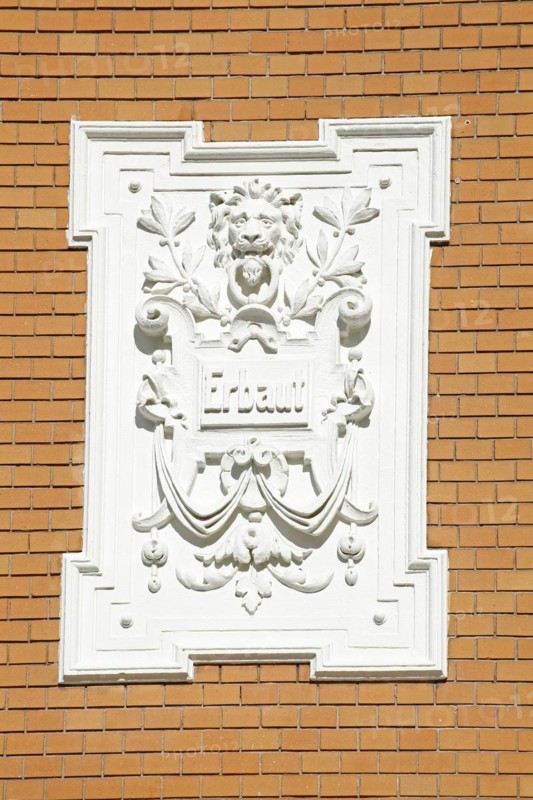 White, decorated plaque on a brick wall of an old Bremen house from the Wilhelminian era, Bremen, Germany, Europe