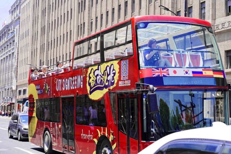 Shanghai, Sightseeing double-decker bus with colourful design drives through the city, Shanghai, China, Asia