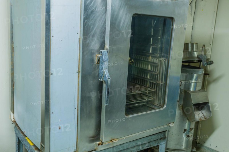 Large metal proofing cabinet with glass door in kitchen of battleship on display at Unification Park in Gangneung, South Korea, Asia