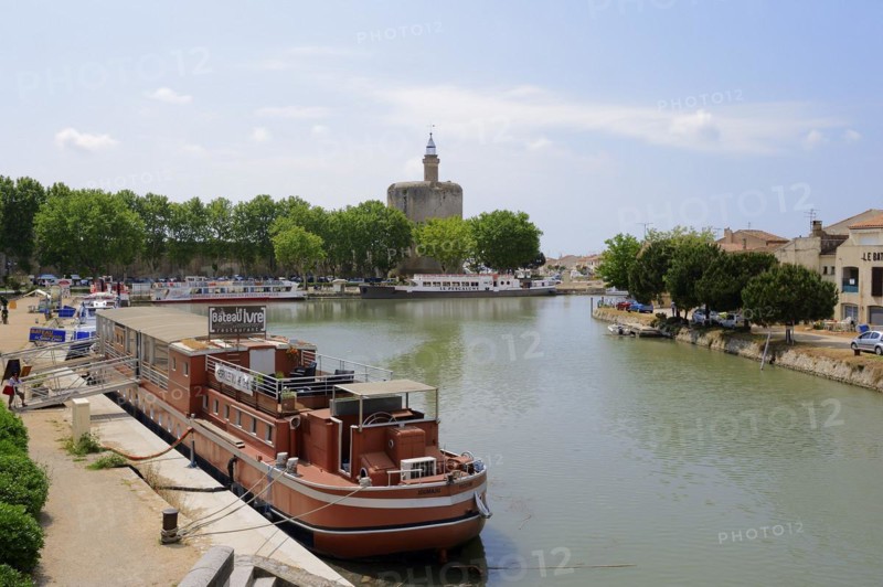 Ship in the harbour and Tour de Constance fortified defence tower, Aigues-Mortes, Camargue, Gard, Languedoc-Roussillon, South of France, France, Europe