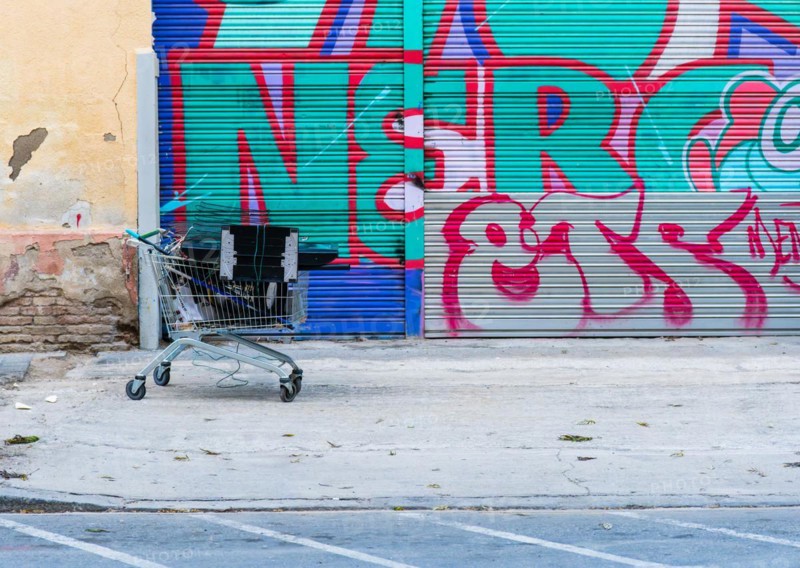 A shopping trolley full of metal and electronic scrap belonging to a scrap collector who sells it for a living, Barcelona, Spain, Europe