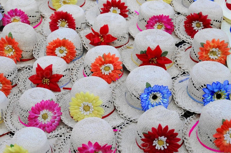 Leon, Nicaragua, Colourful decorated hats with flowers on a traditional market stall, Central America, Central America