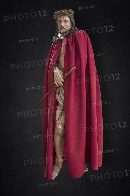 Life-size, carved figure of Jesus with a red cloak on a dark background, 350-year-old processional figure in St Michael's Church, Neunkirchen am Brand, Middle Franconia, Bavaria, Germany, Europe