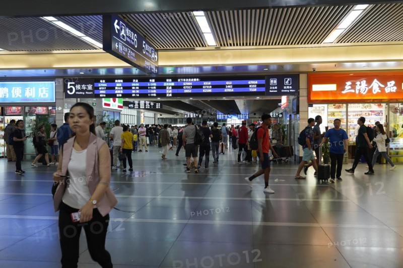 Hongqiao Railway Station, Shanghai, China, Asia, People walking past various shops in a busy airport area, Yichang, Hubei Province, Asia