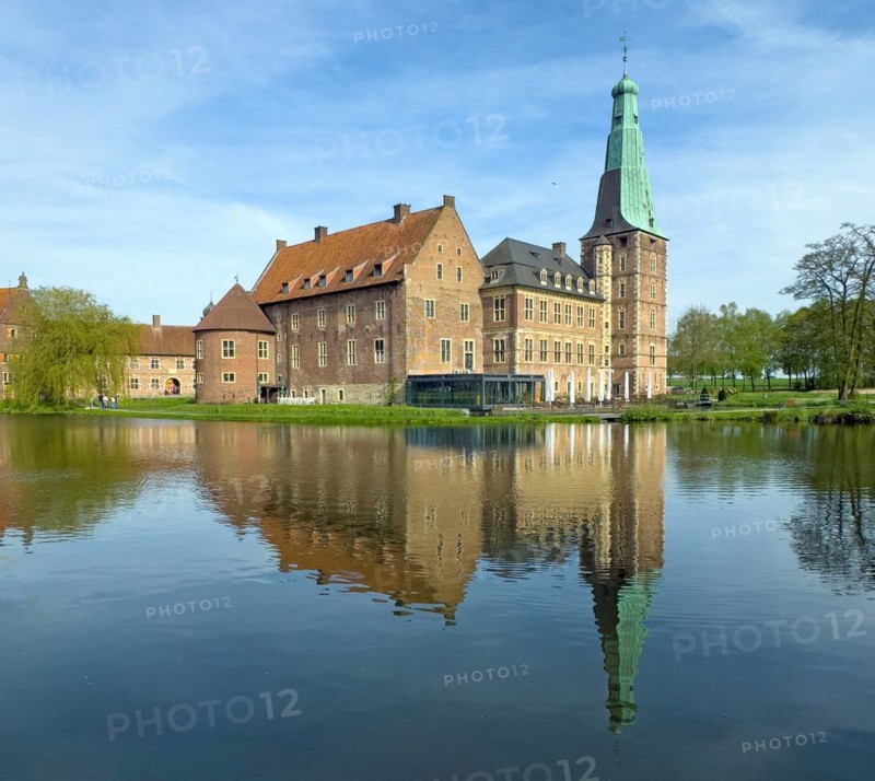 View over moat to historic moated castle from Renaissance Raesfeld Castle reflected in moat in spring, excursion destination in North Rhine-Westphalia, Freiheit Raesfeld, Muensterland, North Rhine-Westphalia, Germany, Europe