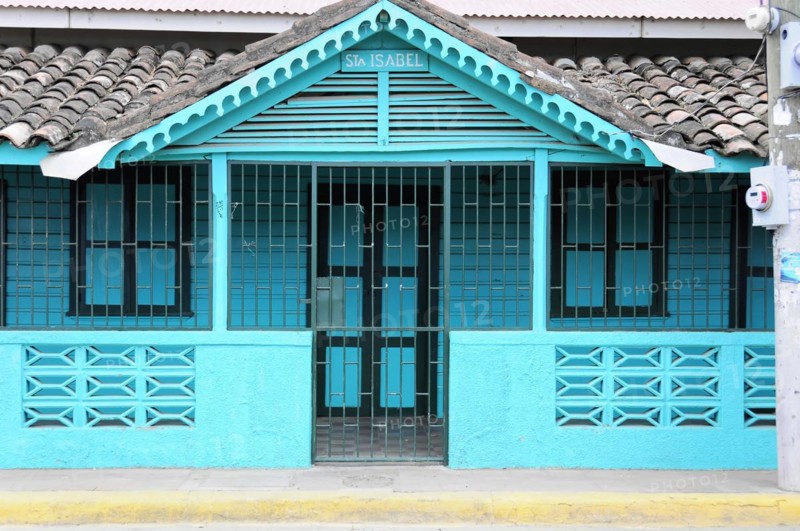 San Juan del Sur, Nicaragua, Turquoise coloured Caribbean house with closed doors and windows, Central America, Central America
