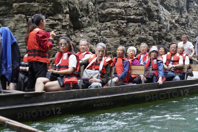 Special boats for the side arms of the Yangtze, for the tourists of the river cruise ships, Yichang, China, Asia, People in orange life jackets sitting in a boat, Hubei province, Asia