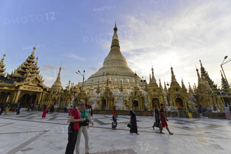 Shwedagon Pagoda, Yangon, Myanmar, Asia, People gather at Shwedagon Pagoda at dusk, Asia