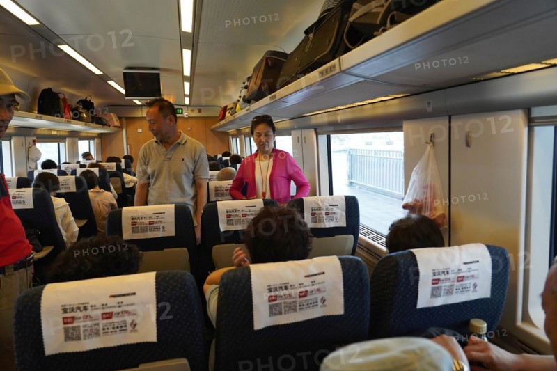 Express train CRH380 to Yichang, passengers in the interior of a train with luggage rack above the seats, Shanghai, Yichang, Yichang, Hubei Province, China, Asia