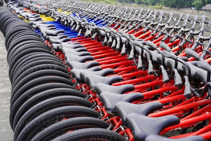 Rental bicycles, Xian, Shaanxi, China, Asia, Orderly rows of bicycles with red frames in a public place, Xian, Shaanxi Province, China, Asia
