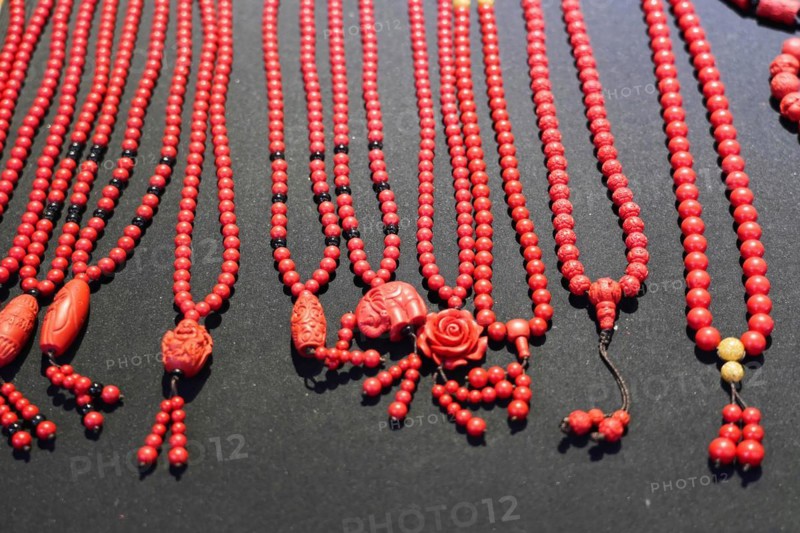 Chongqing, Chongqing Province, China, Asia, Various red, elaborately decorated necklaces and pieces of jewellery presented, Asia