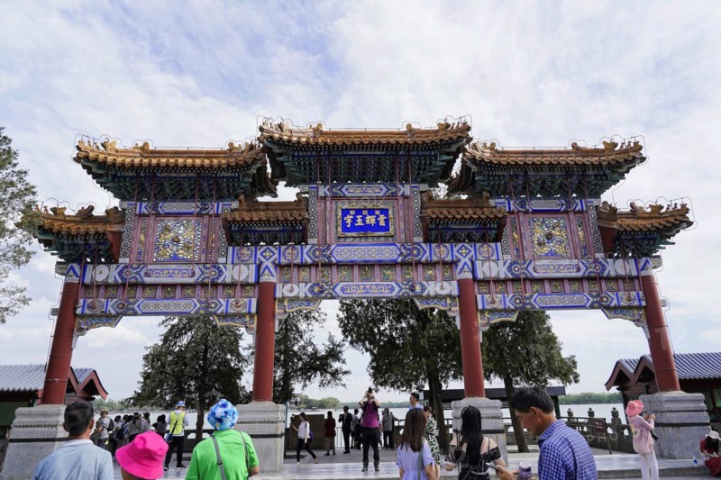New Summer Palace, Beijing, China, Asia, People walk through a magnificent gate of traditional Chinese architecture, Beijing, Asia