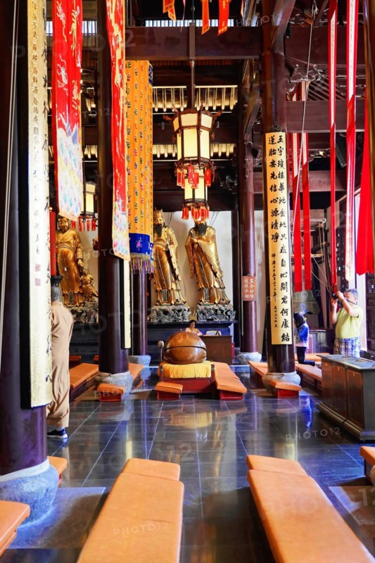 Jade Buddha Temple, Shanghai, Interior view of a temple with statues, wooden benches and red banners, Shanghai, China, Asia