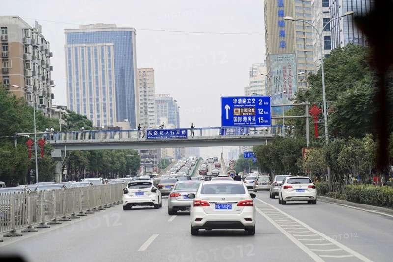 Xian, Shaanxi, China, Asia, city motorway with moving cars and road signs, surrounded by buildings, Asia