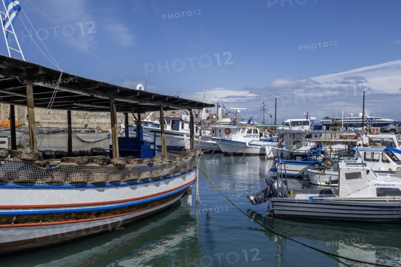 Boats anchoring in Kolona harbour in front of the city wall, Rhodes, Dodecanese archipelago, Greek islands, Greece, Europe