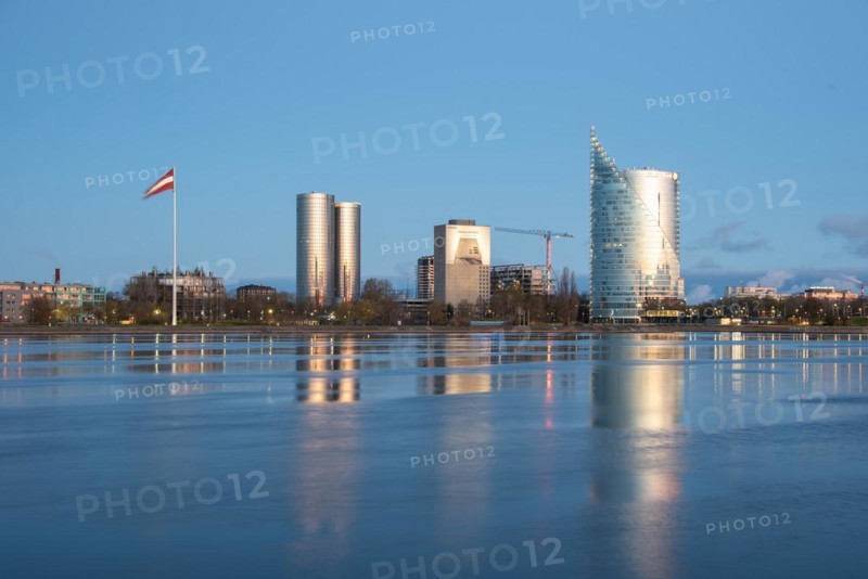 Swedbank headquarters, building reflections on the water, Daugava River, Riga, Latvia, Europe