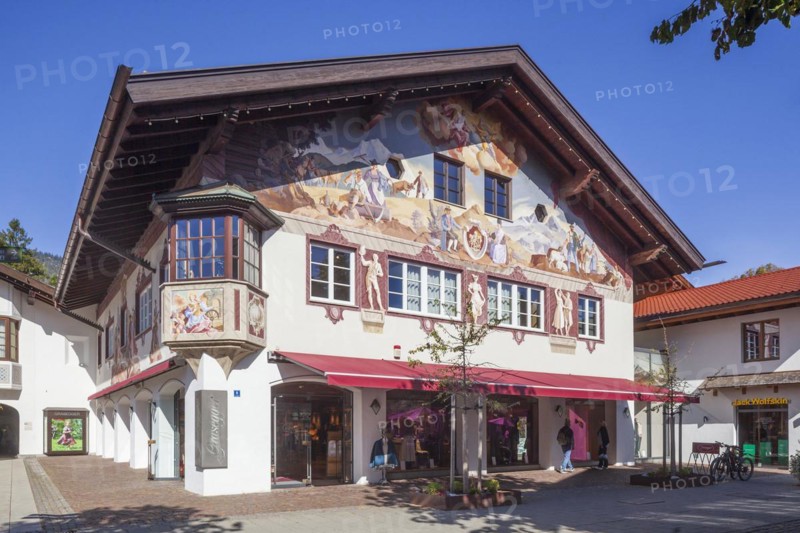 Lueftlmalerei on old house facade with shop in the pedestrian zone of Garmisch, Garmisch district, Garmisch-Partenkirchen, Werdenfelser Land, Upper Bavaria, Bavaria, Germany, Europe