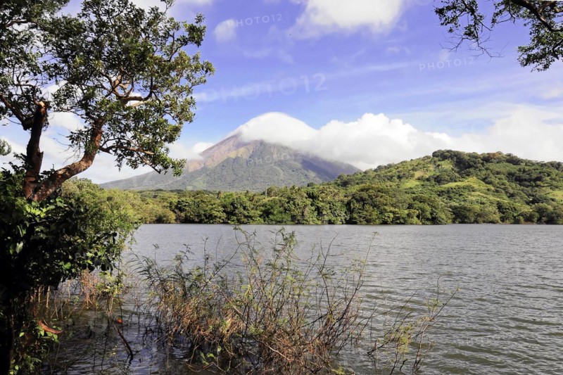 Ometepe Island, Nicaragua, Impressive volcano view over a lake surrounded by green vegetation, Central America, Central America