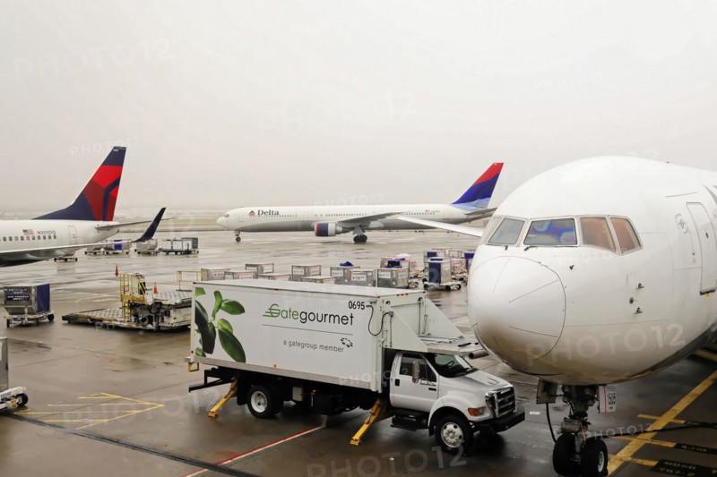 AUGUSTO C. SANDINO Airport, Managua, Nicaragua, Catering vehicle from Gate Gourmet delivers service to a Delta Airlines aircraft, Central America, Central America