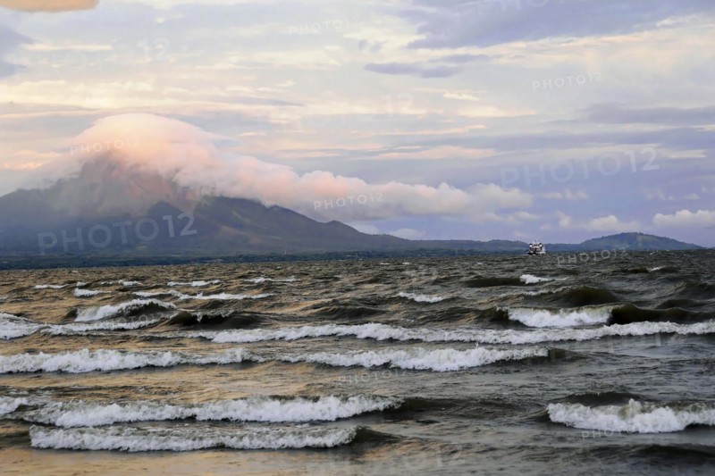 Lake Nicaragua, in the background the island of Ometepe, Nicaragua, Dramatic view of a lake with volcanoes at dusk, Central America, Central America