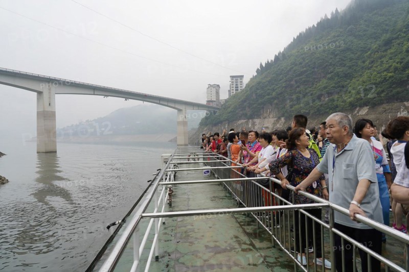 Cruise ship on the Yangtze River, Hubei Province, China, Asia, tourists stand at the railing of a boat and look at a misty river and mountains, Yichang, Asia