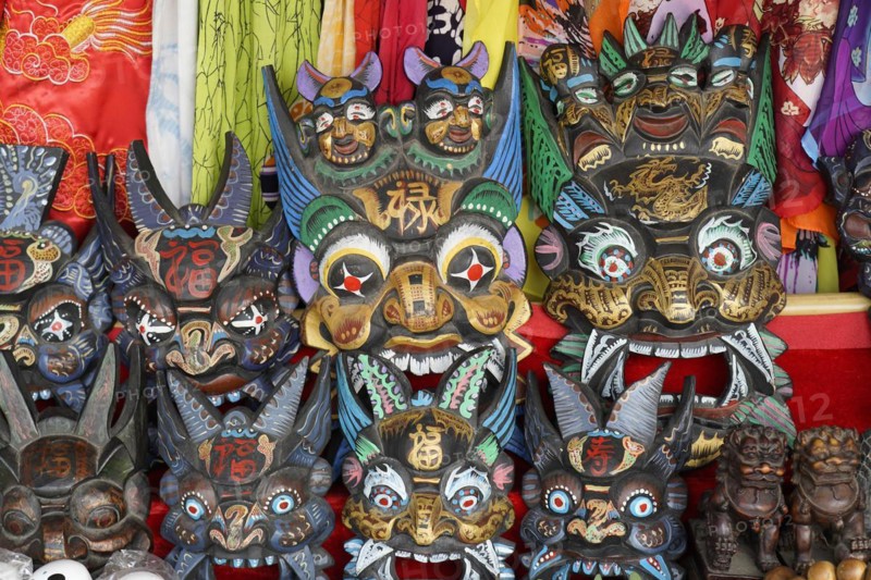 Chongqing, Chongqing Province, souvenirs, stall, on the Yangtze River, masks with elaborate paintings and carvings on display, traditional handicrafts, Yangtze River, Chongqing, Chongqing Province, China, Asia