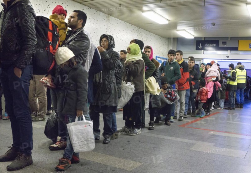 Refugees have arrived at Schoenefeld station on an IC train. They are then taken by bus to accommodation in Berlin, 02.12.2015, Schoenefeld, Brandenburg, Germany, Europe