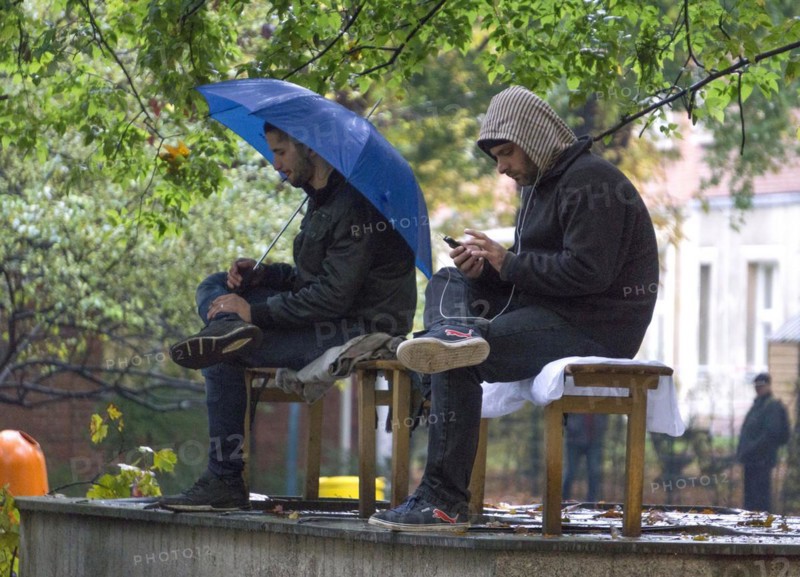 Syrian refugees wait for their registration in cold and wet weather at the Berlin State Office for Health and Social Affairs, 20 October 2015, Berlin, Berlin, Germany, Europe