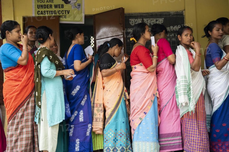 BOKAKHAT, INDIA, APRIL 19: Voters wait in line at a polling station to cast their votes during the first phase of the India's general elections on April 19, 2024 in Bokakhat, Assam, India. Nearly a billion Indians vote to elect a new government in six-week-long parliamentary polls starting today