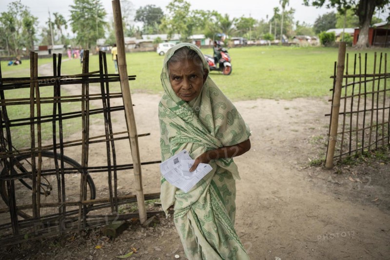 BOKAKHAT, INDIA, APRIL 19: An elderly woman arrives at a polling station to cast her vote during the first phase of the India's general elections on April 19, 2024 in Bokakhat, Assam, India. Nearly a billion Indians vote to elect a new government in six-week-long parliamentary polls starting today