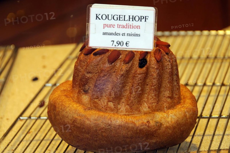 Kaysersberg, Alsace Wine Route, Alsace, Departement Haut-Rhin, France, Europe, An appetising kouglof with almonds and sultanas is offered for EUR7.90, Europe