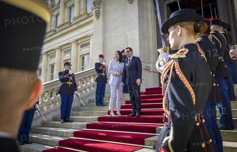 Annalena Baerbock (Alliance 90/The Greens), Federal Foreign Minister, takes a photo as part of her participation in the international humanitarian conference on Sudan and its neighbouring countries. Here she is greeted by Stephane Sejourne, Foreign Minister of France, at the Quai d'Orsay Foreign Ministry. 'Photographed on behalf of the Federal Foreign Office'