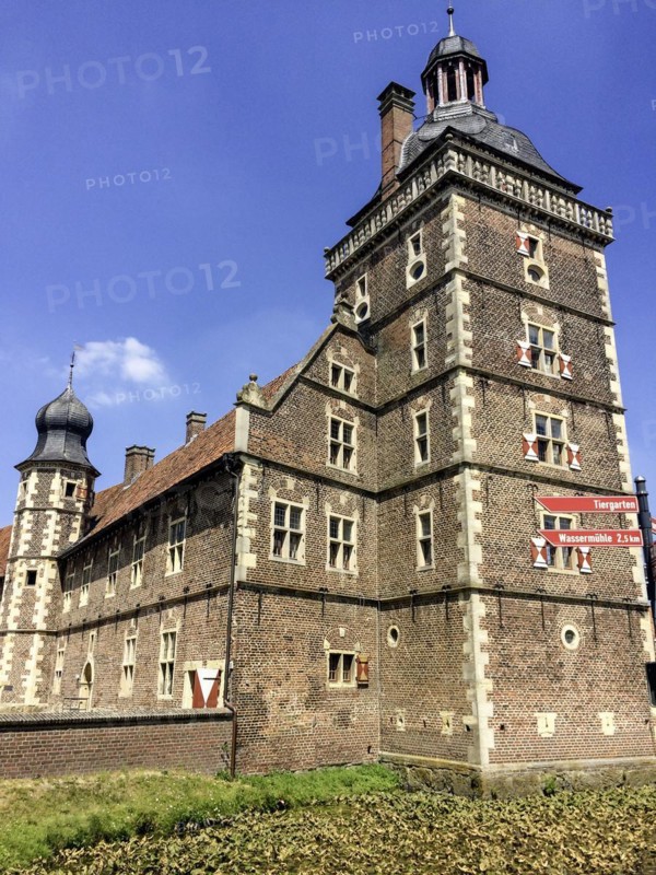 View of in the foreground Sterndeuterturm stands in moat around behind it on the left outer bailey of moated castle Schloss Raesfeld, excursion destination in North Rhine-Westphalia, Freiheit Raesfeld, Muensterland, North Rhine-Westphalia, Germany, Europe
