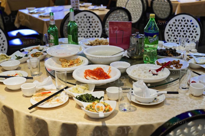 Dinner in a posh restaurant in Shanghai, China, Asia, A meal is over, leftovers and used crockery on a messy table, Shanghai, Asia