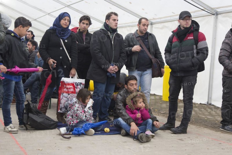 A Syrian refugee family and their children wait in a tent at the Berlin State Office for Health and Social Affairs for their registration, 15 October 2015, Berlin, Berlin, Germany, Europe