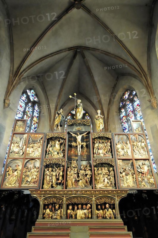 Kaysersberg, Alsace Wine Route, Alsace, Departement Haut-Rhin, France, Europe, A gilded wood carved altar with religious depictions and stained glass, Europe