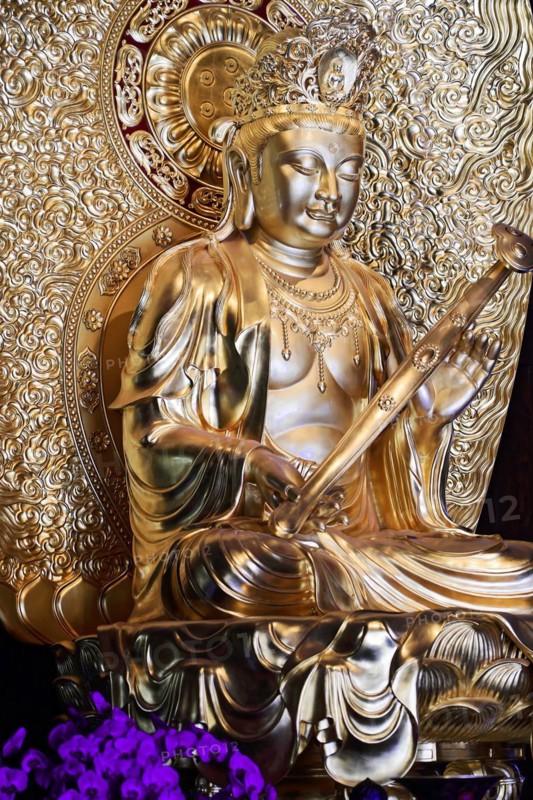 Jade Buddha temple, Shanghai, Detailed golden Buddha statue with fine handwork and ornate embossing, Shanghai, China, Asia