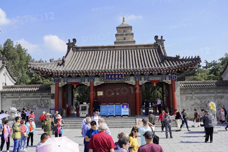 Chongqing, Chongqing Province, China, Asia, Entrance gate to a Chinese temple with people and information signs, Asia