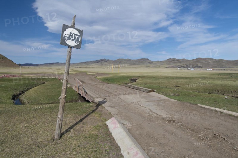Simple bridge over a watercourse in the grassland on the way to Amarbayasgalant Monastery, Selenge Aimak, Selenge Province, Mongolia, Asia
