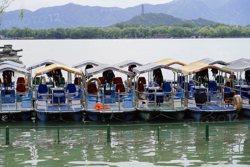 New Summer Palace, Beijing, China, Asia, Several boats on a calm lake in front of a mountain backdrop, Beijing, Asia