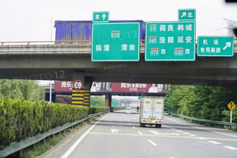 Xian, Shaanxi, China, Asia, View of a motorway with direction signs and passing vehicles, Asia