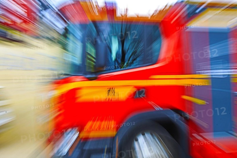 Fire engine in fast motion, which is represented by blurring